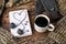 Winter still life with coffee, scarf and book on a wooden table