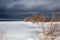 A winter storm approaches the shores of Southern Georgian Bay in Lighthouse Point, Collingwood