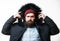Winter stylish menswear. Man bearded stand warm jacket parka isolated on white background. Winter outfit. Hipster winter