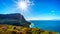 Winter sun casting its rays over the rugged coast and wind swept peaks near Cape Point