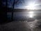 A winter sunny day at the frozen lake. Peaceful and cold.