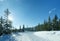 Winter sunny mountain landscape with ski run.