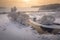 Winter sunrise. Beautiful winter scene on river in frosty morning. Aerial view of winter nature. Snowy landscape from above