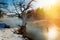 Winter sunrise with a mist on the river with snow