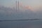 Winter sunrise over the lagoon with a view of the power plant immersed in fog