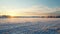 Winter Sunrise Over Snow-covered Farmland In Rural Finland