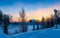 Winter sunrise over a snow-covered lake