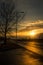 Winter sunset in Belgrade with some dramatic clouds and tree