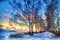 Winter sunset in the birch Avenue. Russia