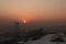Winter sunset in the Kazakhstan capital city Astana with smog smoky fog