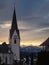 Winter sunset landscape of an old austrian church in an alps village, snowy mountains, Wallfahrtskirche Maria Schnee Matzelsdorf