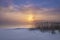 winter sunset on misty lake