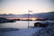 Winter sunset, Scandinavian house, unfrozen sea and low clouds