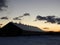 Winter sunset sky showing a dairy barn silhouette