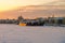 Winter sunset view of the Big Neva and the embankment of Lieutenant Schmidt from the Annunciation Blagoveshchensky bridge with