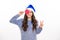 Winter teenager girl with christmas lollipop. Christmas teen girl. Portrait of teenager in winter sweater isolated over