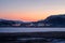 Winter Teriberka. Evening polar landscape with the village of Lodeynoye located between the polar hills