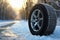 Winter tire covered in snow snowy road ice icy car wheel drive safety safe driving transportation condition change