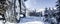 Winter tire. Detail of car tires in winter on the road covered with snow. Panorama, banner.