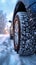 Winter tire grip close up of car tires on a snowy road