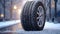 A winter tire on a snow-covered road, ensuring safe and reliable travel