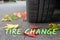 Winter tires with colorful autumn leaves and text tire change