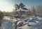 Winter trail along the snow-covered bushes and trees