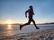 Winter training. Runner in winter landscape with blue sky