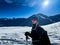 Winter trekker pausing in the serene expanse of the Polish Tatras