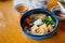 Winter udon with hot tea on wood table