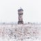 Winter view on an abandoned 19th century ironworks building