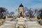 Winter view from the bank of Assiniboine River on Manitoba Legislature building with Louis Riel sculpture in front