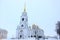 Winter view of the Belltower of the Assumption Cathedral in the city Vladimir Russia from the cathedral square in the cloudy day