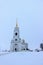 Winter view of the Belltower of the Dormition Cathedral in the city Vladimir Russia from the cathedral square in the cloudy day.