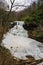 A Winter View of the Frozen Cascade Falls