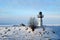 Winter view of the new steel lighthouse on the embankment of the Volga river.