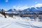 Winter view of polar industrial city surrounded with snow mountains