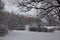 Winter view to Toompea. Snowy landscape in a park. Trees and ground are covered with snow. Snelli park, Tallinn, Estonia