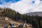 Winter view of winter ski resort with houses, cottages and woods