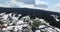 Winter. Village on a hill in the woods. Aerial view