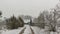 Winter village landscape with wooden house