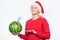 Winter vitamin fruit ration. Strengthen immunity concept. Girl wear santa hat drink watermelon vitamin cocktail straw