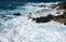 Winter waves crash on the rocky shoreline at Kaena Point on Oahu