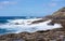 Winter waves crash on the rocky shoreline at Kaena Point on Oahu