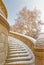 Winter white snow covered winding steps stairway