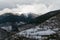 Winter in winter Pyrenees mountains. snow-covered stone terrace and icy mountain peaks on background