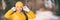 Winter woman happy wearing yellow hat and gloves for cold weather panorama banner. Asian girl smiling outdoor in forest