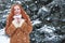 Winter woman outdoor portrait, snowy fir trees background