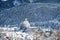 Winter wonderland in Switzerland with Scuol church and cemetery