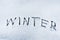 Winter word written in snow